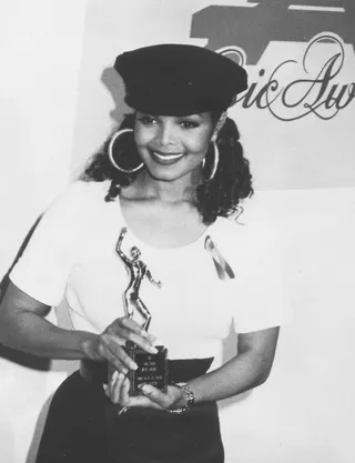 Soul Train - Janet accepted her Soul Train Award back in 1992 wearing graphic tee and large hoop earrings.&nbsp; (Photo by Harry Langdon/Getty Images)