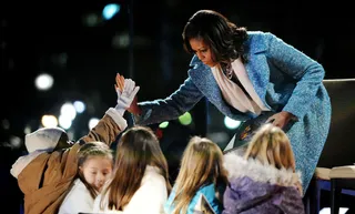High Five! - Obama gives high five to kids after story time.(Photo: Olivier Douliery-Pool/Getty Images)