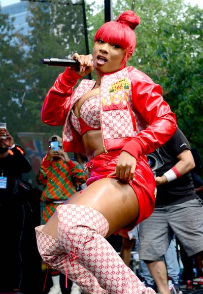 Made In Houston - Megan Thee Stallion hit the Made In America festival looking like literal money! The Hottie closed out her Hot Girl Summer with a bang, twerking in a red hot, custom, Gucci X Dapper Dan 'fit including a leather sleeved, checkered jacket with matching brassiere, booty shorts and thigh high boots. (Photo: Lisa Lake/Getty Images for Roc Nation)&nbsp;