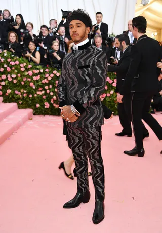 Lewis Hamilton in Tommy Hilfiger - (Photo: Dimitrios Kambouris/Getty Images for The Met Museum/Vogue)&nbsp;