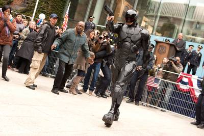 Weapons of Choice - RoboCop has two main weapons: a high-powered Taser that comes out of his thigh and a gun that deploys from his forearm.&nbsp; According to Whist, “when we designed the Taser...we wanted it to seem real, to have a logic to it.&nbsp; It had to be a certain size – after all, it had to fit in the leg.&nbsp; And then we had to figure out how it would deploy in a cool way that he could grab onto.” (Photo: MGM/Columbia Pictures)