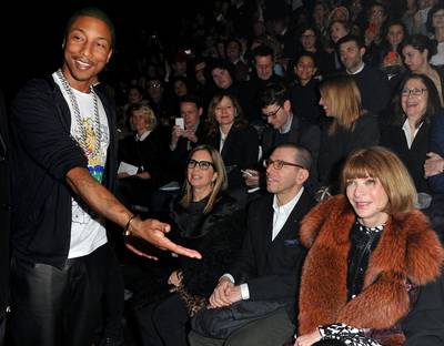 Pharrell in Paris  - Pharrell Williams pretends to introduce Anna Wintour to photogs in the front row of the Lanvin Ready-To-Wear Fall/Winter 2012 show during Paris Fashion Week at Halle Freyssinet in Paris, France.(Photo: Pascal Le Segretain/Getty Images)