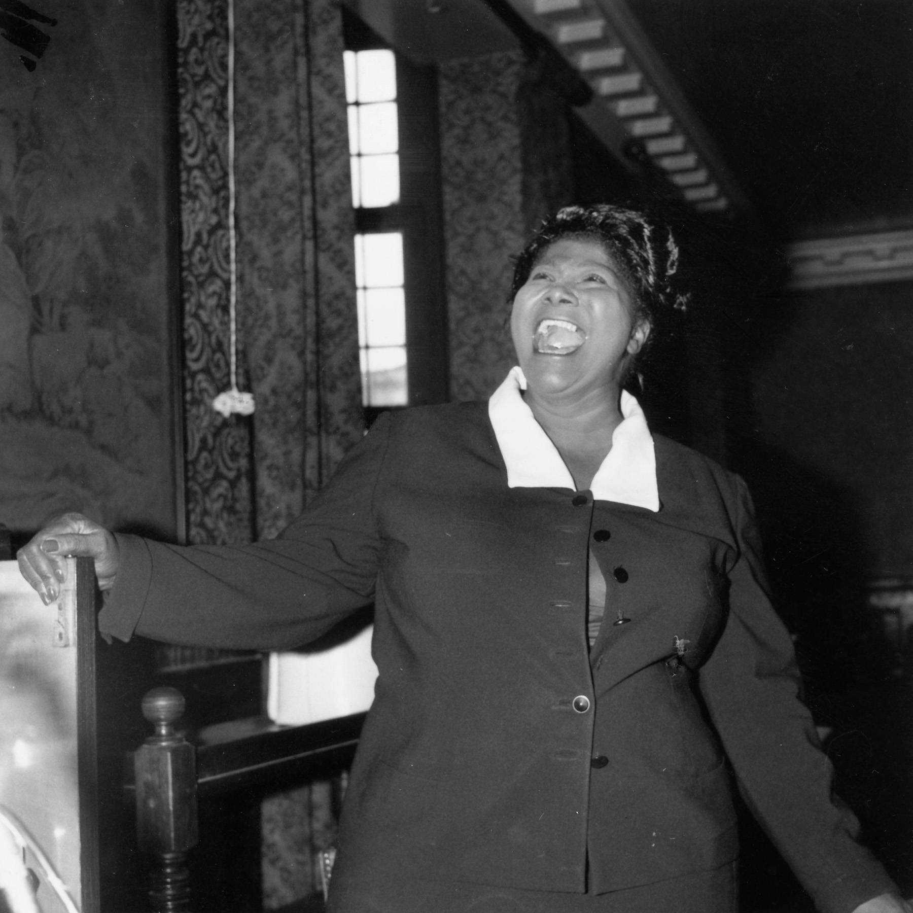 The Chicago Move and a Burgeoning Career - In 1927 at the age of 16, Mahalia Jackson moved to Chicago, Illinois. She worked as a domestic in homes in Chicago, but still satiated her passion for music by joining the Greater Salem Baptist Church Choir. Her powerful contralto voice was distinctive from early on, and found her work as a soloist in the city. She began touring with the Prince Johnson singers throughout the city.(Photo: Douglas Miller/Keystone/Getty Images)