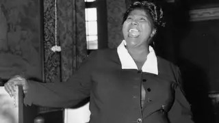 The Chicago Move and a Burgeoning Career - In 1927 at the age of 16, Mahalia Jackson moved to Chicago, Illinois. She worked as a domestic in homes in Chicago, but still satiated her passion for music by joining the Greater Salem Baptist Church Choir. Her powerful contralto voice was distinctive from early on, and found her work as a soloist in the city. She began touring with the Prince Johnson singers throughout the city.(Photo: Douglas Miller/Keystone/Getty Images)