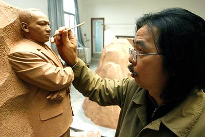 February 2007 - The Martin Luther King Jr. National Memorial Project Foundation announces the selected quotations from Dr. King's writing, sermons and speeches to be engraved onto the memorial wall. The foundation also announces Master Lei Yixin (pictured) as the sculptor who will carve the image of Dr. King into the Stone of Hope. There is some controversy over the foundation's decision to select the Chinese artist.(Photo: LIU JIN/AFP/Getty Images)