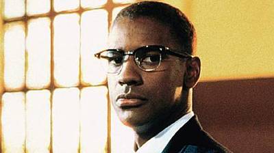 Denzel Washington as Malcolm X - Playing the role of slain Black nationalist leader Malcolm X wasn’t a stretch for Denzel Washington, having played him on stage in the play When the Chickens Come Home to Roost. In Spike Lee’s Malcolm X, Washington earned an Oscar nomination.\r(Photo: Courtesy of Largo International)