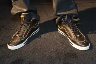 Smack - black/gold Versace First Jewel high top - Smack straight said that he "liked that they were different." The styling is undeniably unique and is very much the definition of flossy.(Photo: Paras Griffin/BET/Getty Images for BET Networks)