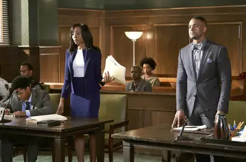 Actors Erica Ash as Gwen Sullivan and Ronnie Rowe Jr. as A.D.A. E.J. DaShay on set of episode 102 of BET's In Contempt. 