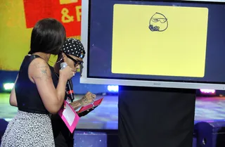 Focused - Bow Wow attempts to draw Rick Ross at 106 &amp; Park, October 4, 2012. (Photo: John Ricard / BET).