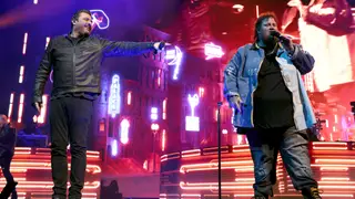 NASHVILLE, TENNESSEE - DECEMBER 09: Chris Young and Jelly Roll perform onstage at Bridgestone Arena on December 09, 2022 in Nashville, Tennessee.