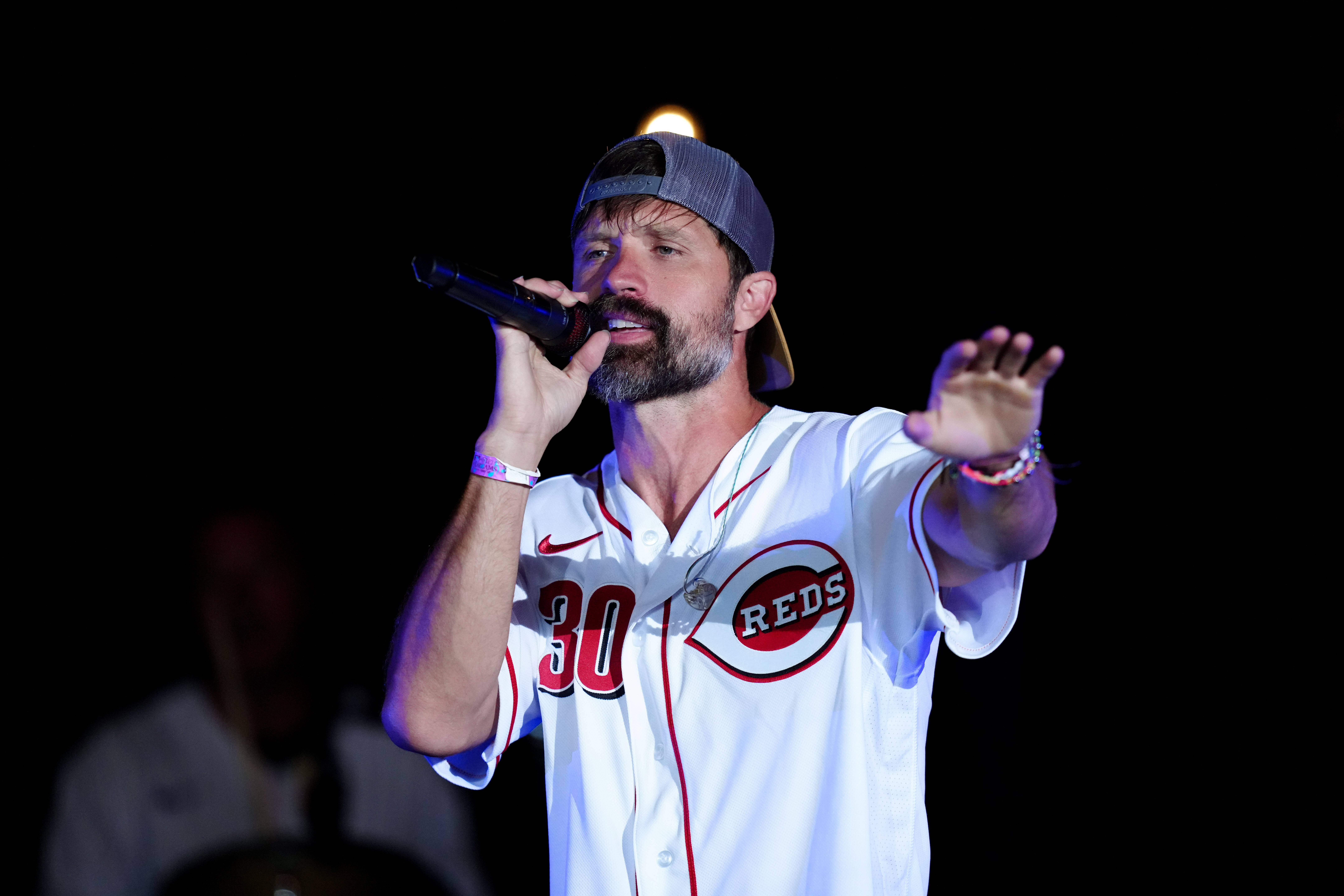 DYERSVILLE, OH - AUGUST 11: Walker Hayes performs after the game between the Chicago Cubs and the Cincinnati Reds at The MLB Field at Field of Dreams on Thursday, August 11, 2022 in Dyersville, Iowa. 
