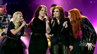 NASHVILLE, TENNESSEE - NOVEMBER 09: (L-R) Pillbox Patti, Ashley McBryde, Brandy Clark and Caylee Hammack perform onstage at The 56th Annual CMA Awards at Bridgestone Arena on November 09, 2022 in Nashville, Tennessee. 