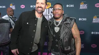 NASHVILLE, TENNESSEE - APRIL 11: Walker Hayes and Nelly attend the 2022 CMT Music Awards at Nashville Municipal Auditorium on April 11, 2022 in Nashville, Tennessee.