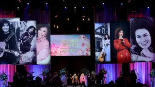 NASHVILLE, TENNESSEE - OCTOBER 30: (L-R) Presley Tanita Tucker, Tanya Tucker and Layla Tucker perform onstage for CMT Coal Miner's Daughter: A Celebration of the Life & Music of Loretta Lynn at Grand Ole Opry on October 30, 2022 in Nashville, Tennessee.