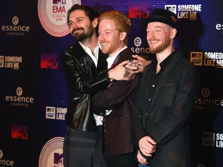 mgid:file:gsp:scenic:/international/mtvema/2014/images/galleries/2014-ema-red-carpet/Simon-Neil-Ben-Johnston-James-Johnston-458697580.jpg