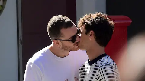 Sam Smith has been spotted kissing Brandon Flynn.
