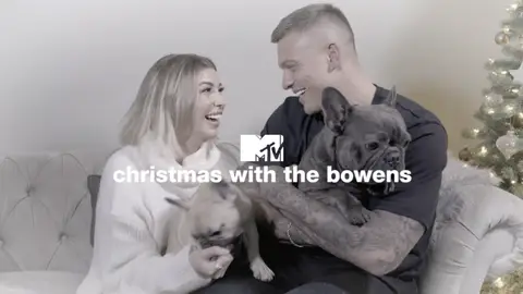 Olivia Buckland and Alex Bowen and home with their dogs