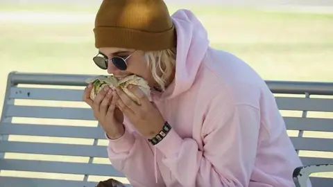Justin Bieber eating a sideways burrito