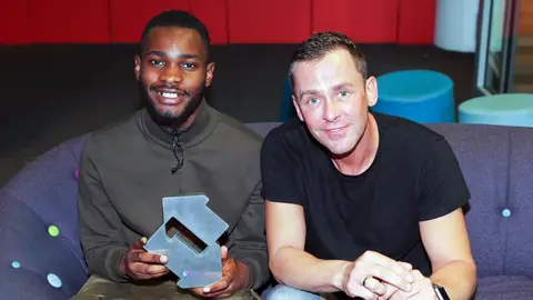 Dave and Fredo with Scott Mills celebrating 'Funky Friday' debuting at Number 1 on the Official Singles Chart 