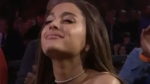 Ariana Grande squinting at the MTV VMAs.
