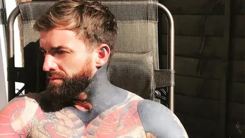 Geordie Shore's Aaron Chalmers defends his decision to get a blacked out tattoo on his arm