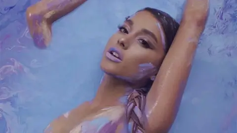 Ariana Grande goes topless on the God Is A Woman cover