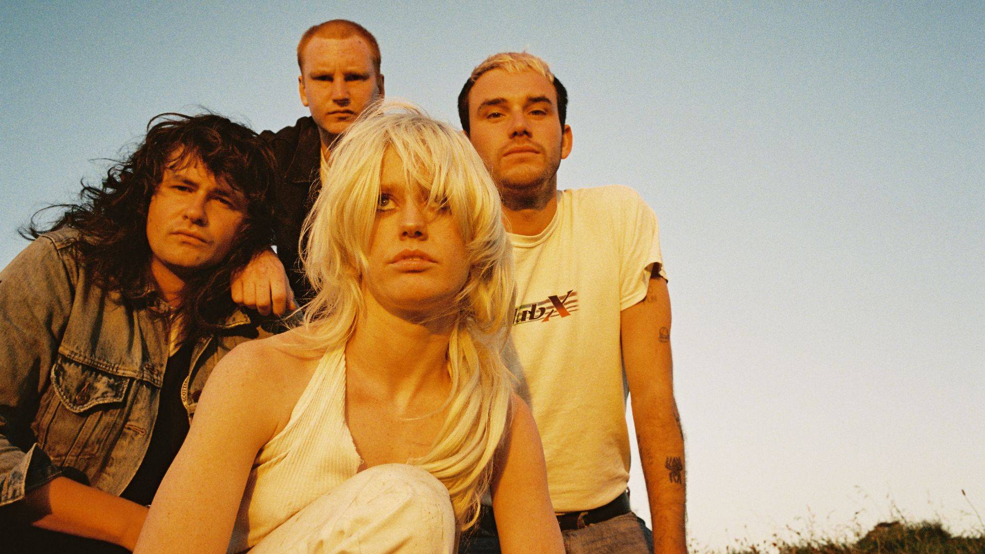 Amyl and The Sniffers band Comfort To Me posing together sunset