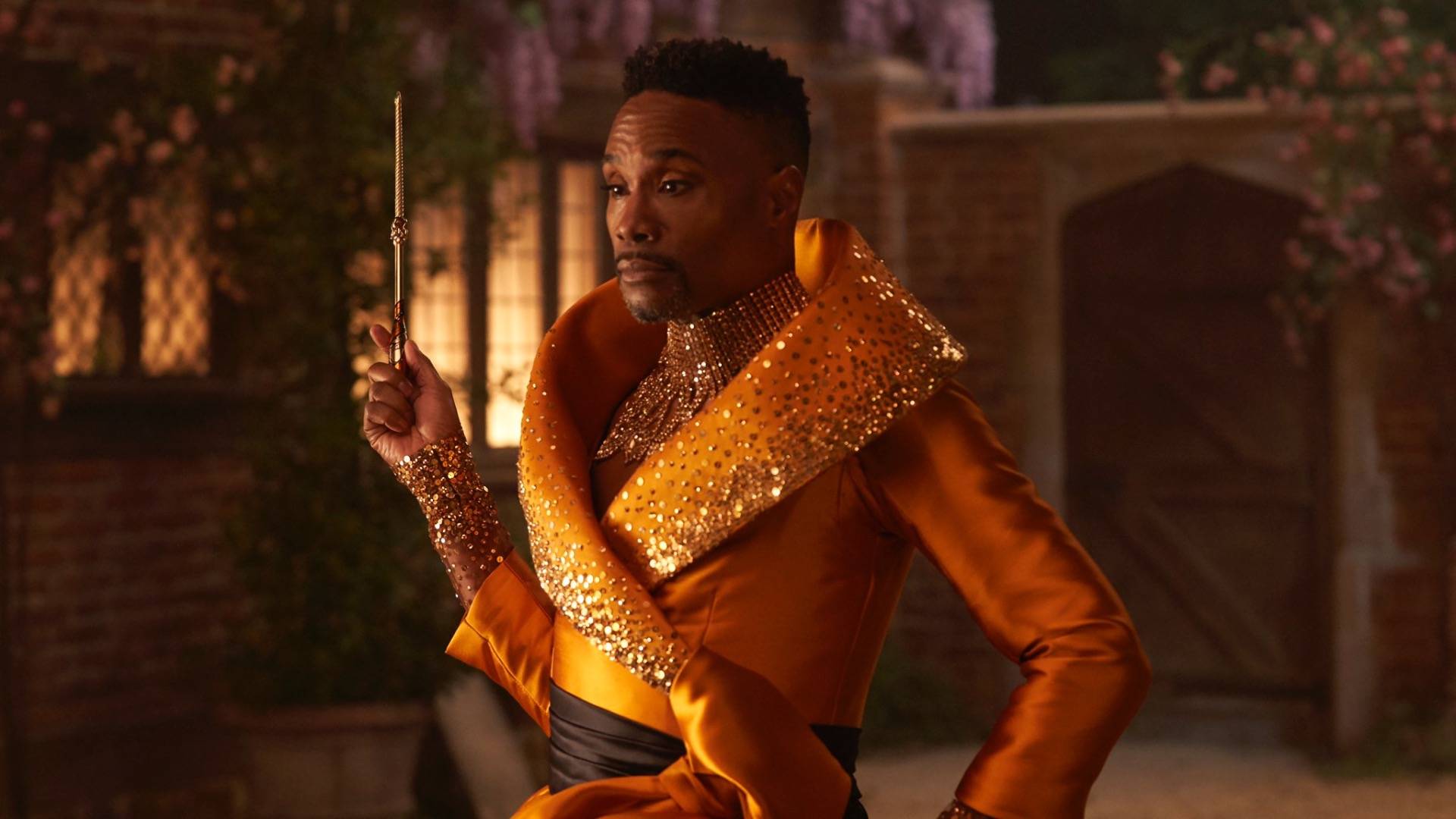 Billy Porter As Fairy Godparent In Orange Sparkly Outfit Holding Magic Wand 