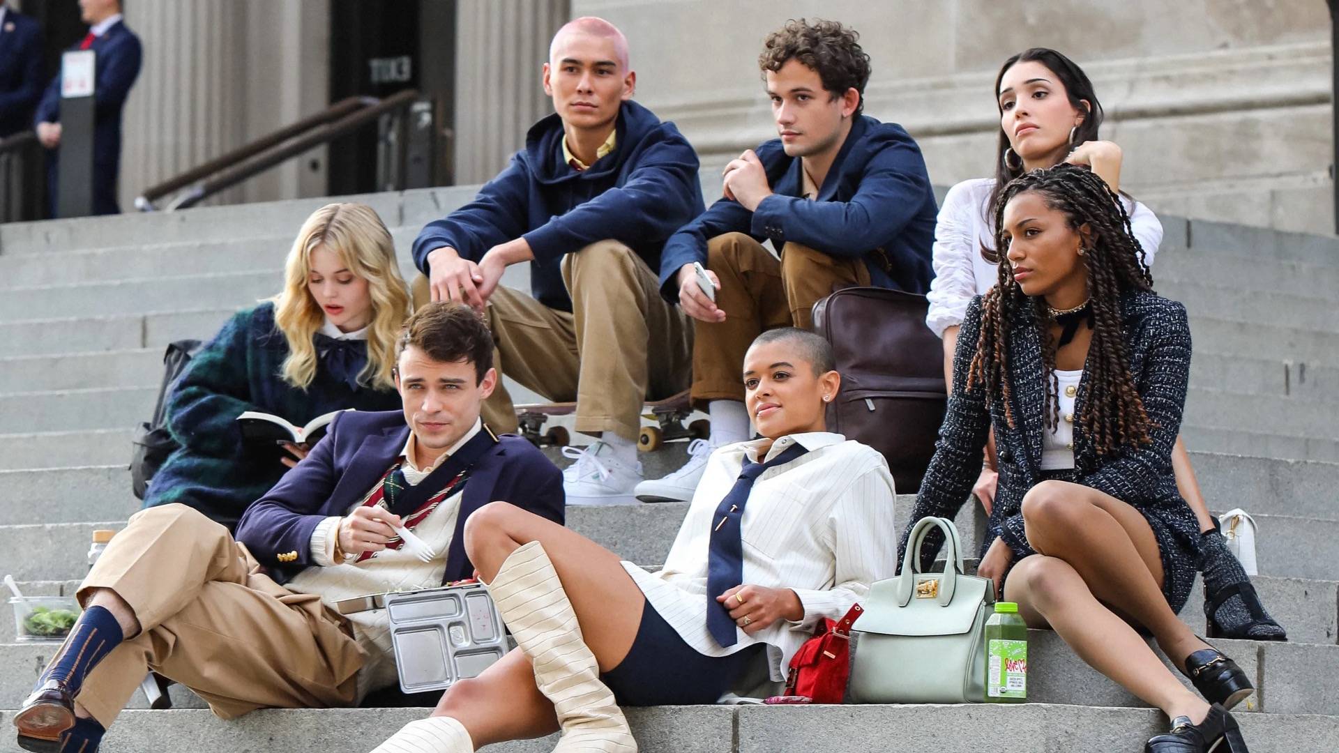 Cast Of Gossip Girl Reboot sitting on steps 