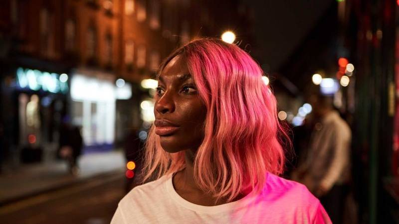 Michaela Coel in white t-shirt looking off camera in "I May Destroy You" 
