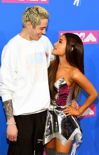 Pete Davidson showed support to his fiance and VMA performer Ariana Grande by rocking her “Sweetener” album merch on the 2018 Video Music Awards red carpet.