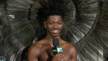 Lil Nas X talks about cheering Jack Harlow on at the MTV VMAs 2022, celebrates his new role as a brand ambassador for YSL and gives Nessa the deets about his bold look.