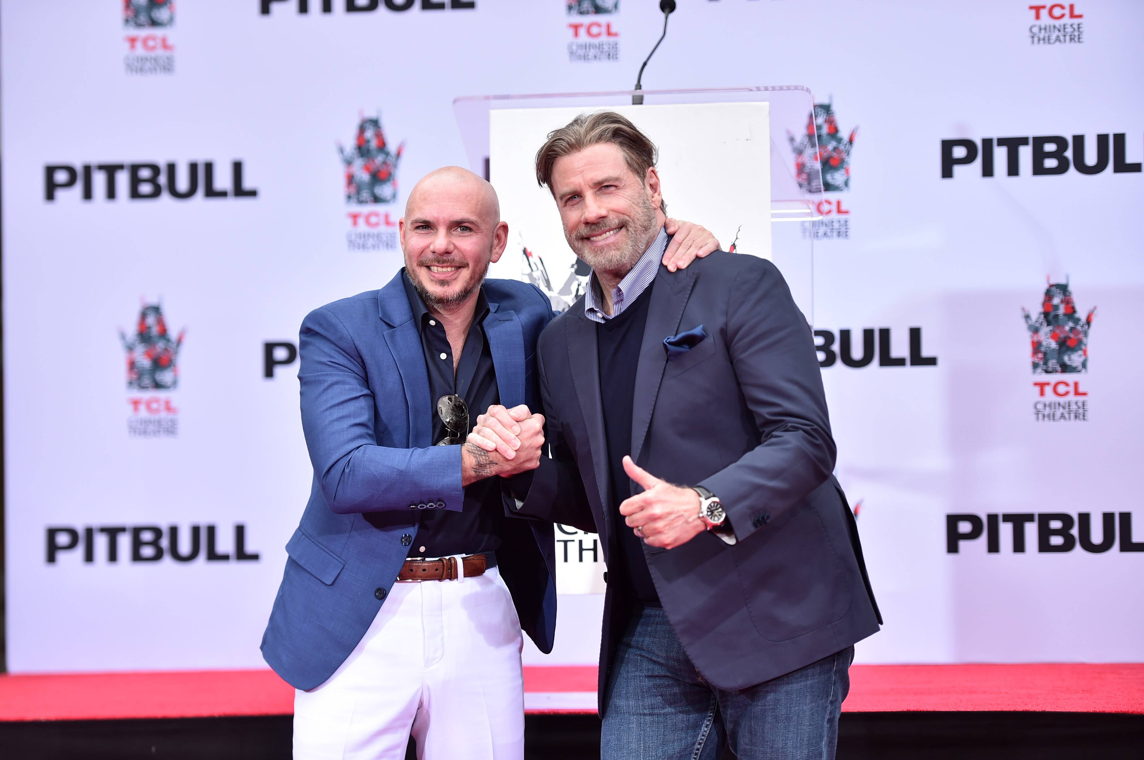Surprise! Pitbull's '3 To Tango' Video Stars A Bald, Dancing John Travolta  | News | MTV