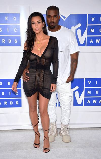 Multi-talented moguls Kim Kardashian and Kanye West looked fashion-forward (as usual) on the 2016 VMA red carpet.