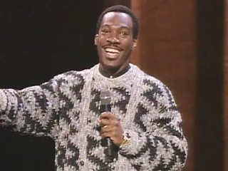 Comedian Eddie Murphy proved to be an over-the-top host at the 1985 VMAs by strolling through women's bathrooms and even taking to the streets to find a co-host. (MTV)