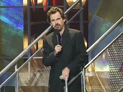 Wiseguy Dennis Miller took over the 1995 and 1996 VMAs with his cooler-than-you attitude filled with cunning cracks at celebs. (MTV)