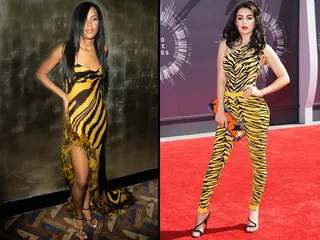 Fashion icon Aaliyah made a memorable statement at the 2000 VMAs, wearing a yellow zebra print dress and strappy heel. Fourteen years later, pop star Charli XCX brought yellow zebra print back to the carpet, this time in a one-piece pant suit.