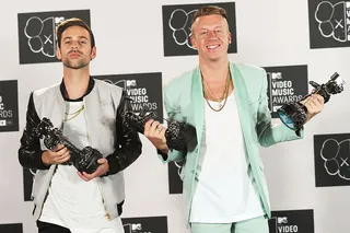 Super producer Ryan Lewis and his hip-hop partner in crime Macklemore show they've come a long way from shopping in thrift shops as they strike a pose with their hard-earned 2013 VMA trophies.