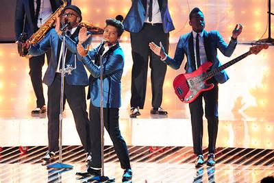 Bruno Mars pays tribute to the late Amy Winehouse with "Valerie" on stage at the 2011 MTV Video Music Awards in Los Angeles.