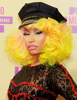 Nicki Minaj is no stranger to colorful hair. At the 2012 VMAs, she turned heads in electric yellow curls and soft pink highlights.