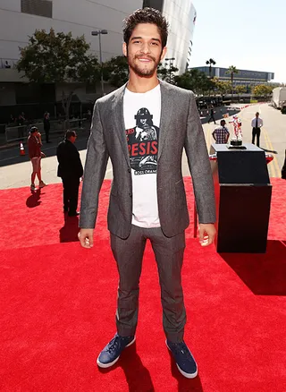 MTV's 'Teen Wolf' stud Tyler Posey mixes business with pleasure in a slim-fitting suit and navy sneakers at the 2012 Video Music Awards.