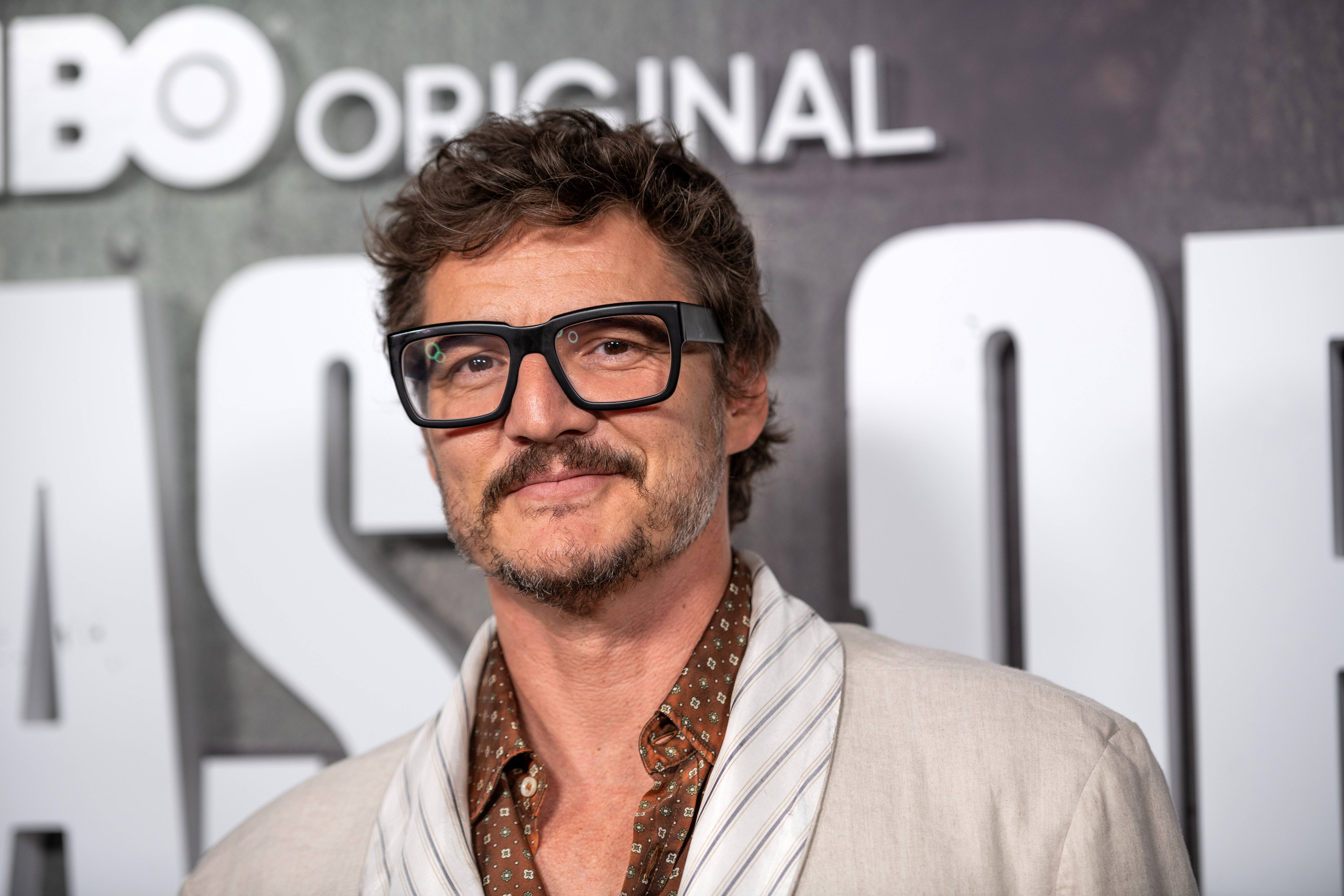 Pedro Pascal poses with incredible black-framed glasses