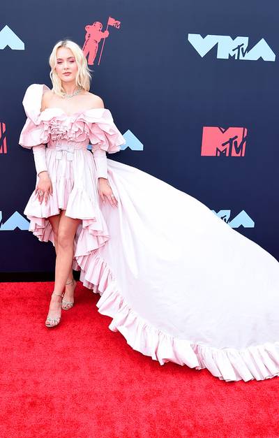 Swedish singer-songwriter Zara Larsson's flowing dress makes a statement on the red carpet.