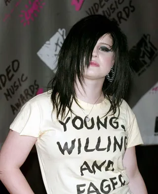 Kelly Osborne tires of only displaying her angst on her T-shirts, so she showed off her emo mindset with a dark and jagged do that covers one eye at the 2003 VMAs.
