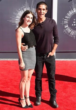 'Teen Wolf' star Tyler Posey looks cool and casual at the 2014 MTV Video Music Awards with Seana Gorlick.