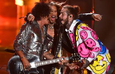 Post Malone, Aerosmith and 21 Savage perform “Rockstar,” “Dream On,” and “Toys In The Attic” on stage creating one of the most epic collaborations of the 2018 VMAs.