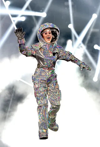 Katy Perry lands on stage dressed as the infamous Moonperson to host the 2017 VMAs. Her opening monologue, pop-culture hitting outfits, and closing performance alongside Nicki Minaj were out of this world! (Getty Images)