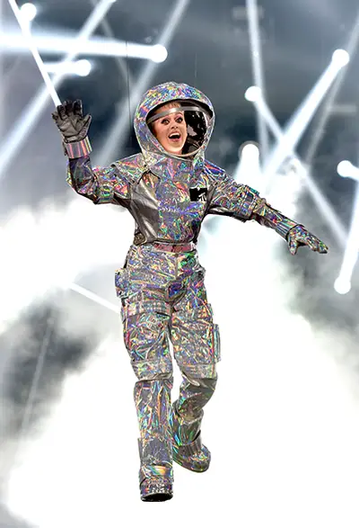 Katy Perry lands on stage dressed as the infamous Moonperson to host the 2017 VMAs. Her opening monologue, pop-culture hitting outfits, and closing performance alongside Nicki Minaj were out of this world! (Getty Images)