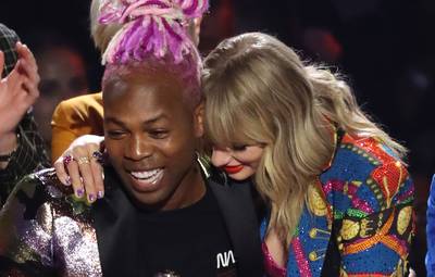 Taylor Swift hugs friend and co-producer of “You Need to Calm Down,” Todrick Hall.