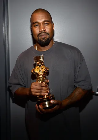 2015 Video Vanguard recipient and future presidential candidate Kanye West poses with his all-gold Moonman commemorating his illustrious career in music.